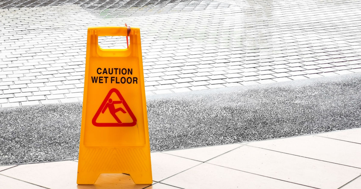 wet floor sign, slip and fall injury prevention sign